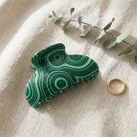 Side profile of emerald malachite claw clip showing gold spring